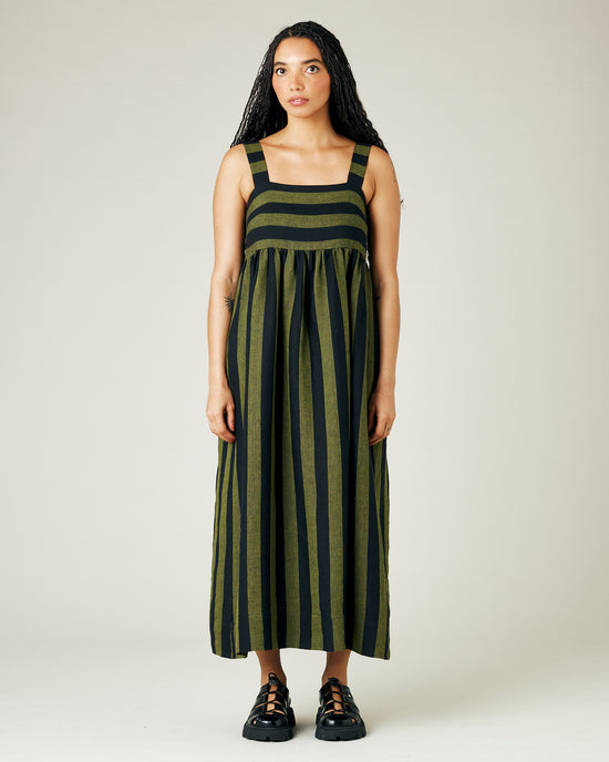 model wears olive and black stripe linen suki dress