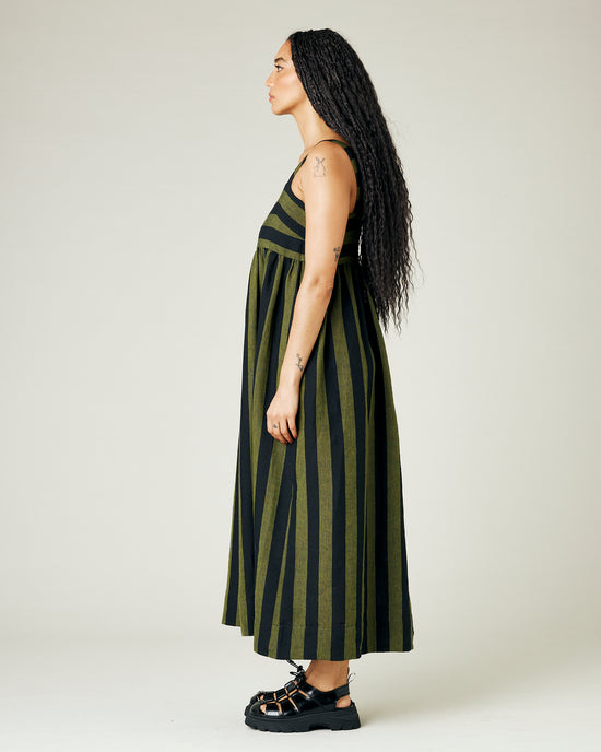 model wears olive and black stripe linen suki dress