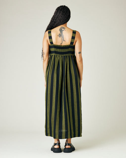 model wears olive and black stripe linen suki dress