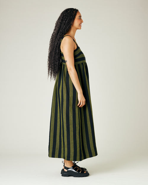 model wears olive and black stripe linen suki dress