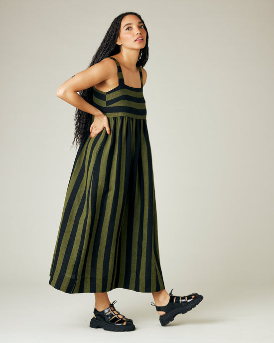 model wears olive and black stripe linen suki dress