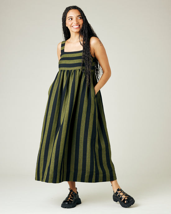 model wears olive and black stripe linen suki dress