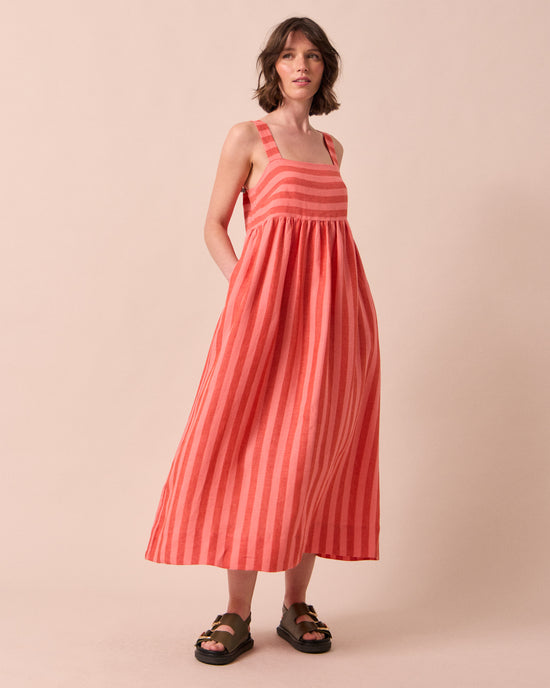 model wears suki sorbet stripe linen dress