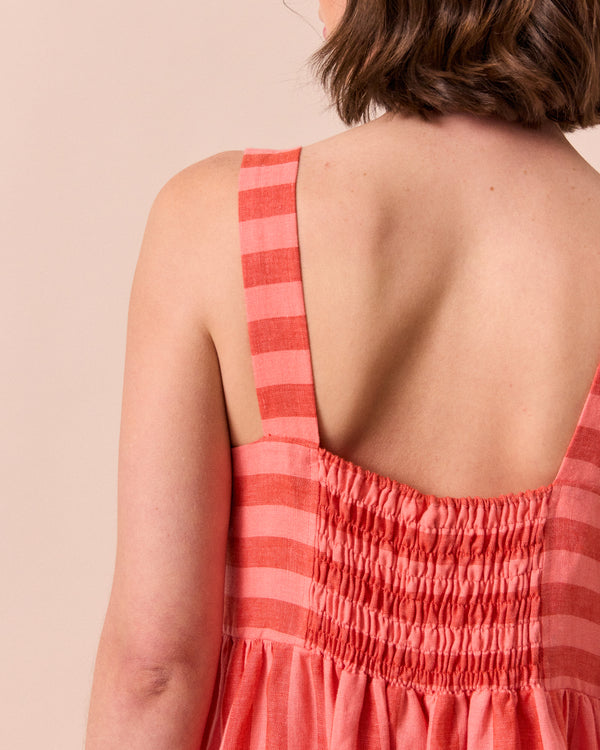 model wears suki sorbet stripe linen dress