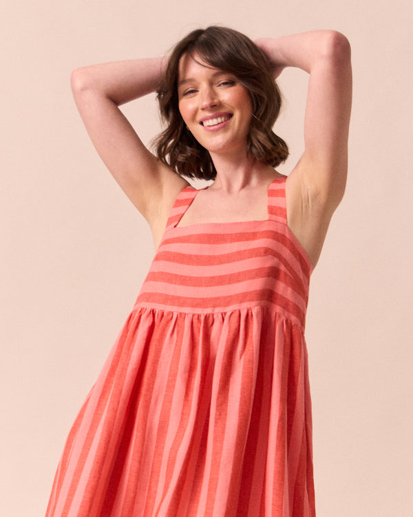 model wears suki sorbet stripe linen dress