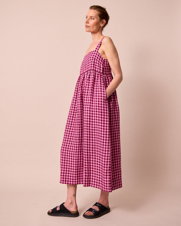 model wears suki summer berry gingham linen dress