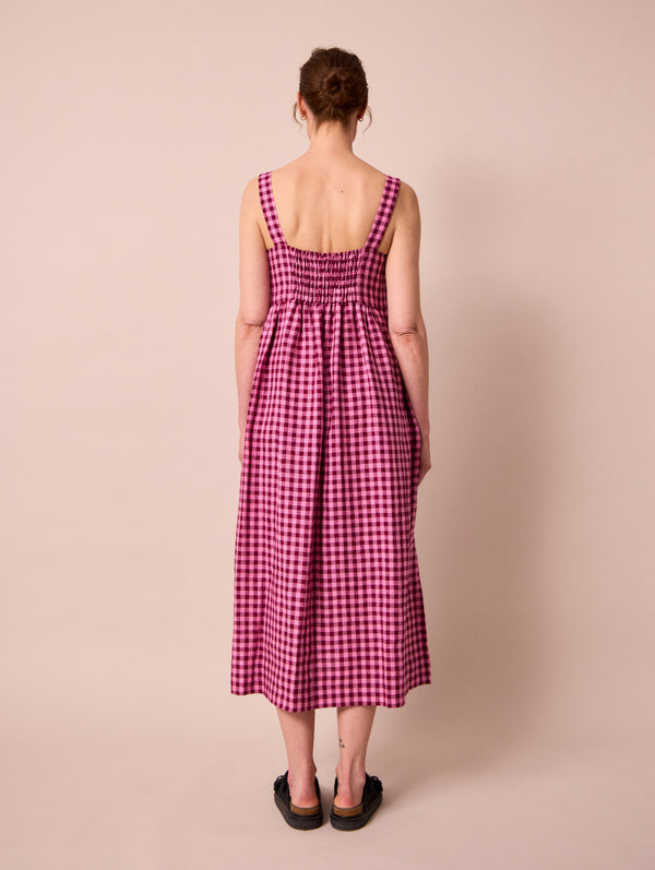 model wears suki summer berry gingham linen dress