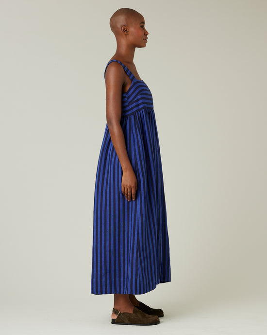 model wears indigo stripe linen suki dress