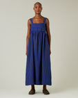 model wears indigo stripe linen suki dress