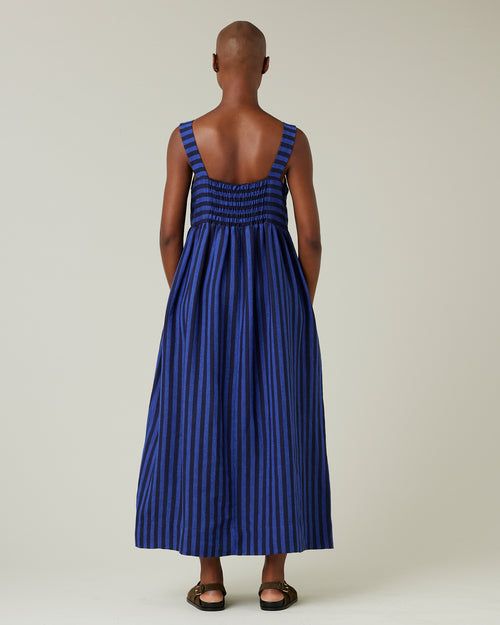 model wears indigo stripe linen suki dress