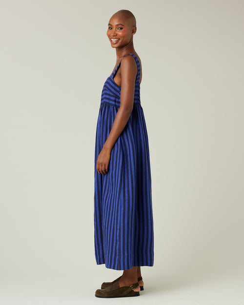 model wears indigo stripe linen suki dress