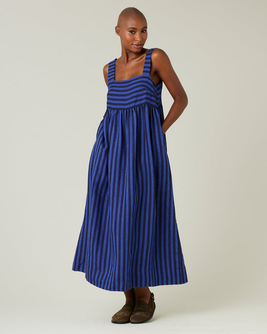 model wears indigo stripe linen suki dress