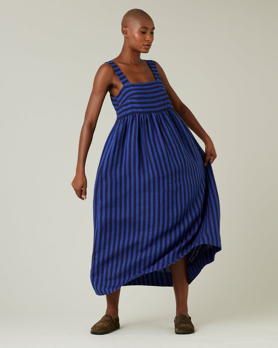 model wears indigo stripe linen suki dress