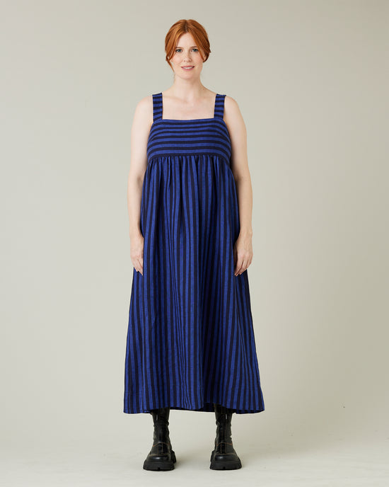 pregnant model wears indigo stripe linen suki dress