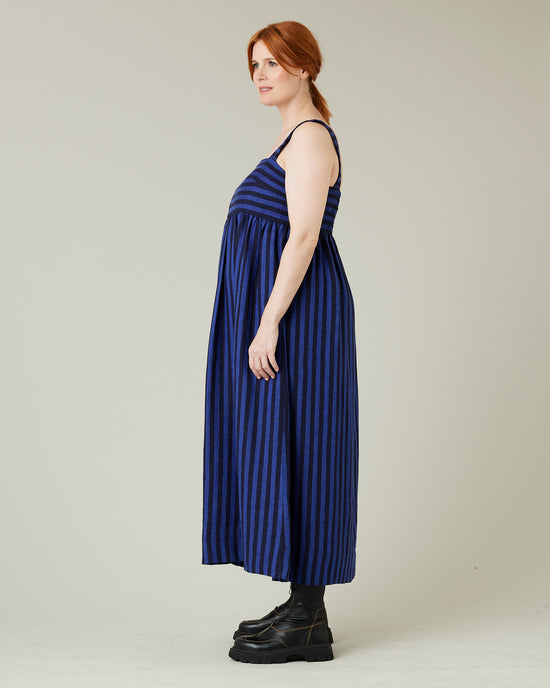 pregnant model wears indigo stripe linen suki dress