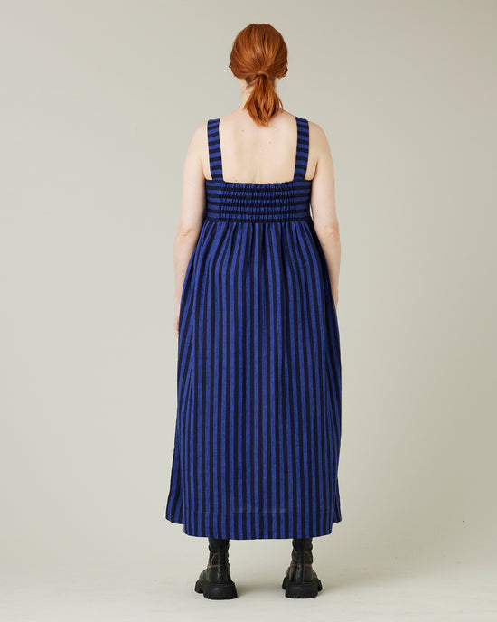 pregnant model wears indigo stripe linen suki dress