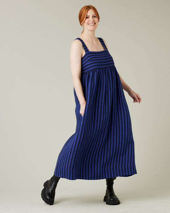 pregnant model wears indigo stripe linen suki dress