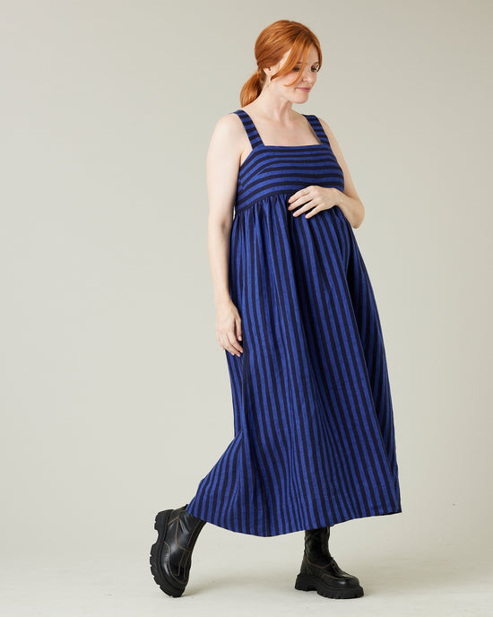 pregnant model wears indigo stripe linen suki dress