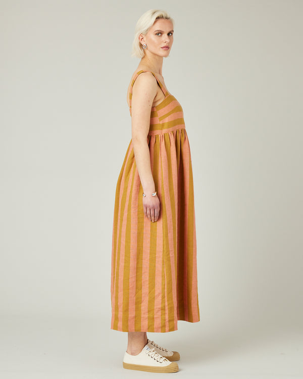 model wears pollen stripe suki linen dress