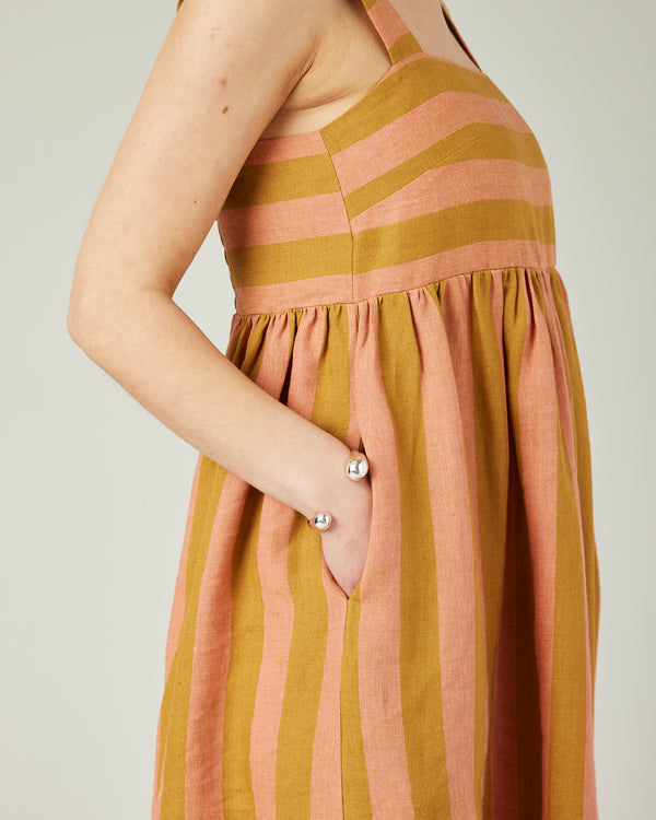 model wears pollen stripe suki linen dress