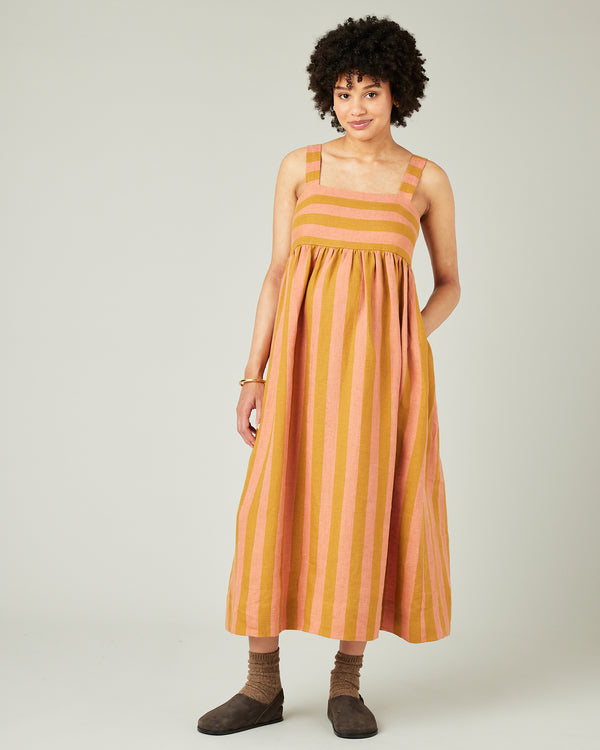 pregnant model wears pollen stripe suki linen dress