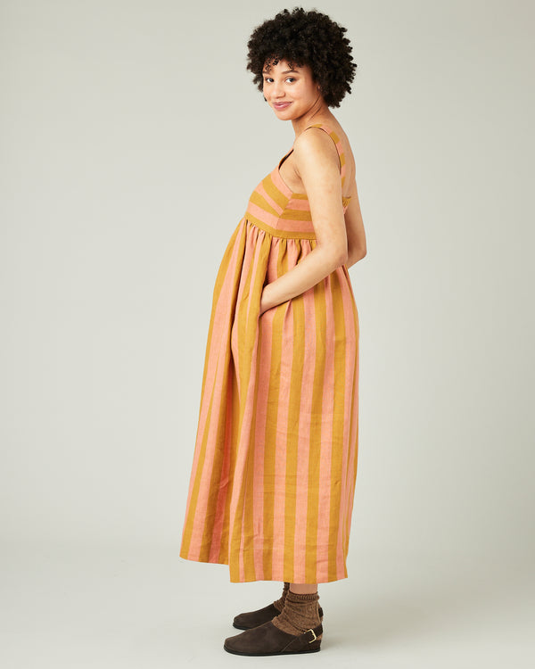 pregnant model wears pollen stripe suki linen dress