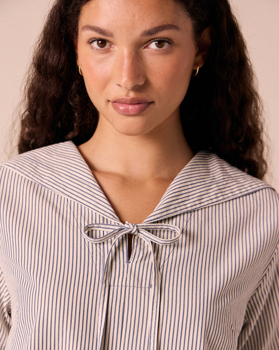 models wears sylvia stripe cotton dress.