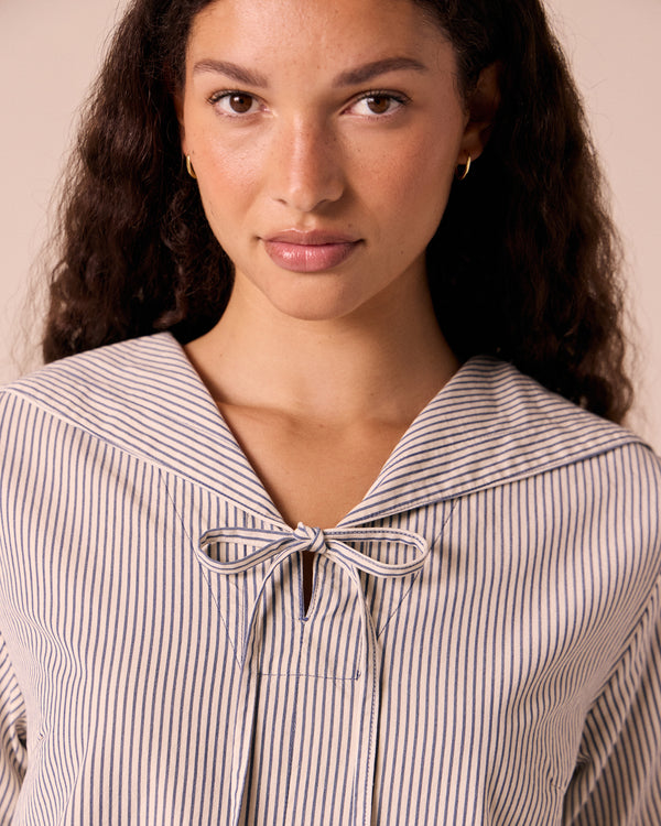 models wears sylvia stripe cotton dress.