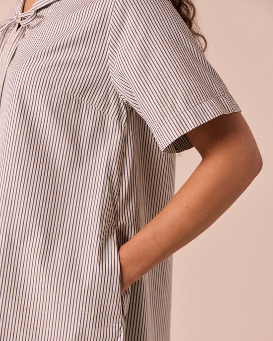 models wears sylvia stripe cotton dress.
