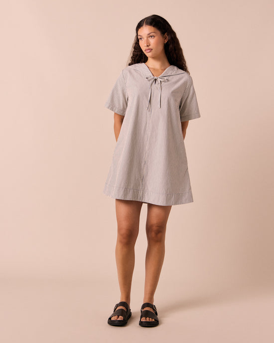models wears sylvia stripe cotton dress.