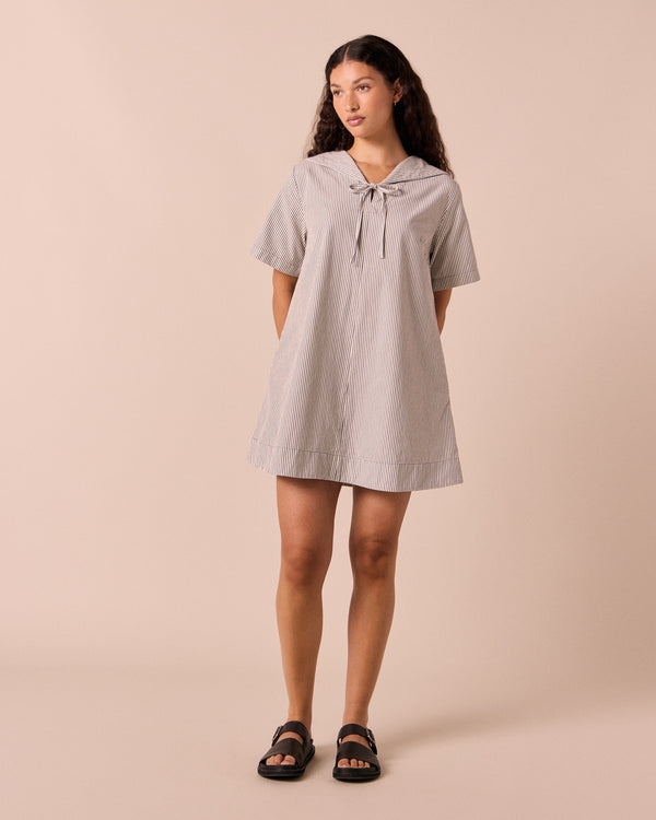 models wears sylvia stripe cotton dress.