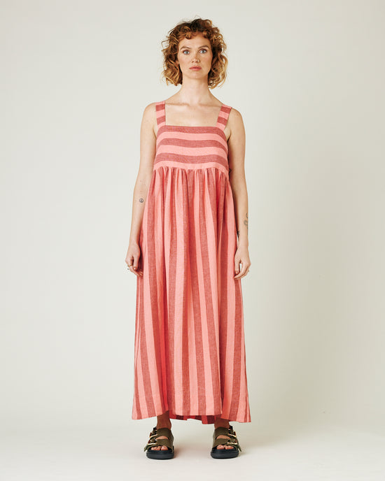 model wears blush stripe linen suki dress