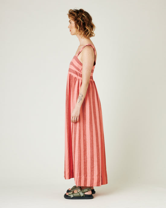 model wears blush stripe linen suki dress