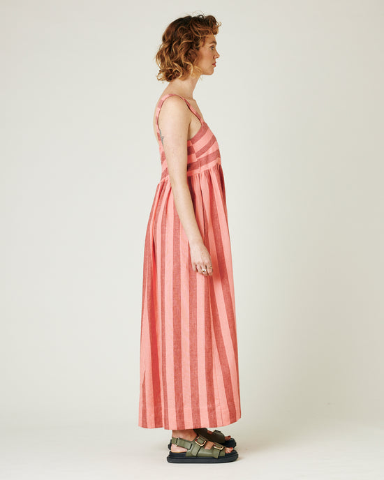 model wears blush stripe linen suki dress