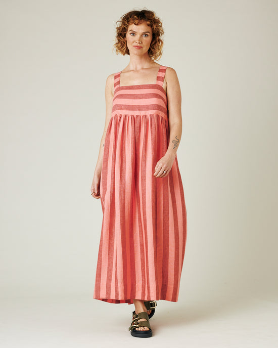 model wears blush stripe linen suki dress