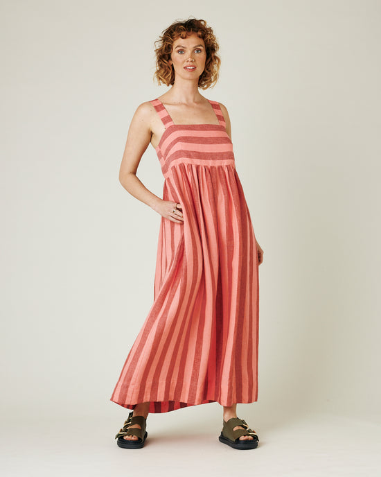 model wears blush stripe linen suki dress