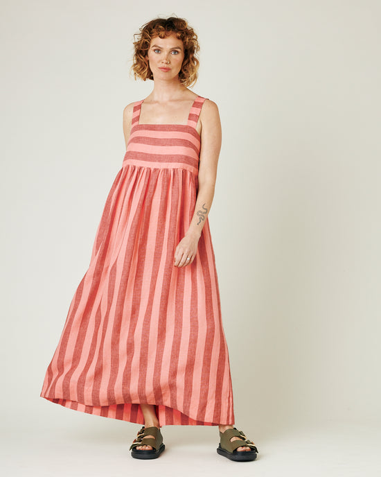 model wears blush stripe linen suki dress