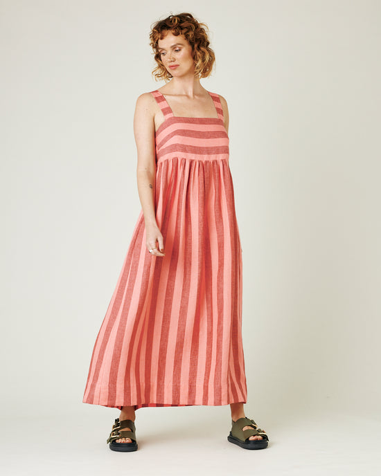 model wears blush stripe linen suki dress