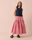 model wears talia neopolitan check textured cotton skirt