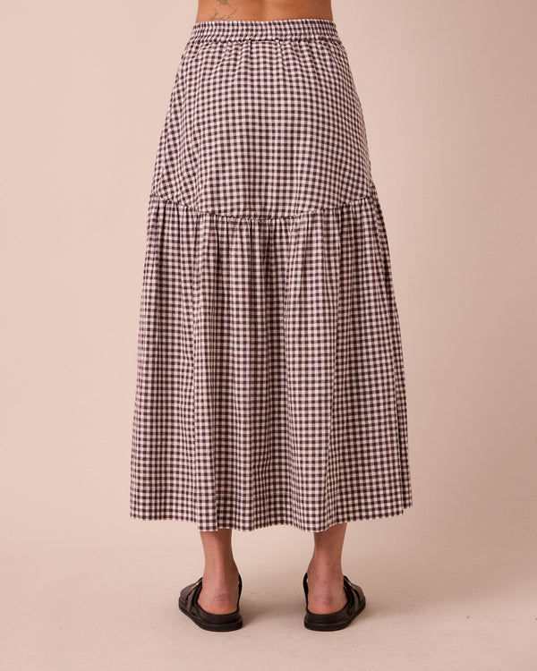 model wears talia ganache gingham cotton linen skirt