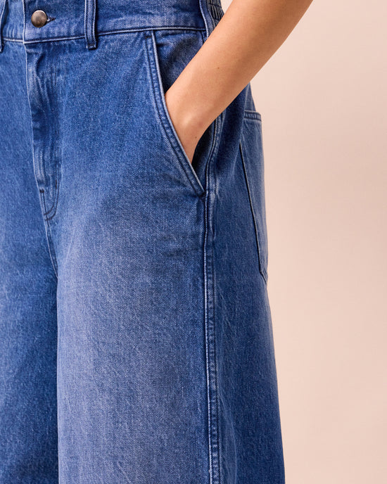 model wears tavi mid blue denim jeans right