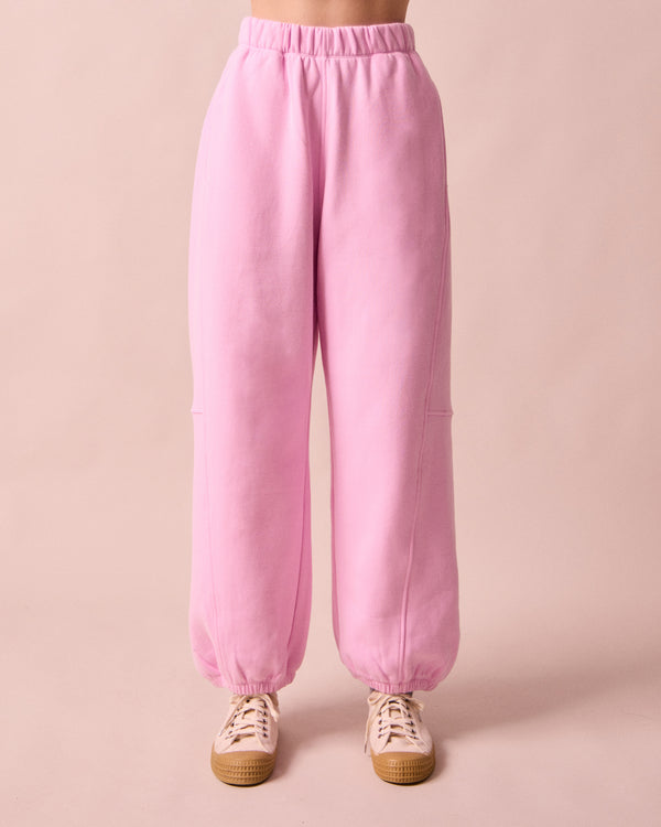 model wears tegan orchid pink fleeceback jersey trousers front