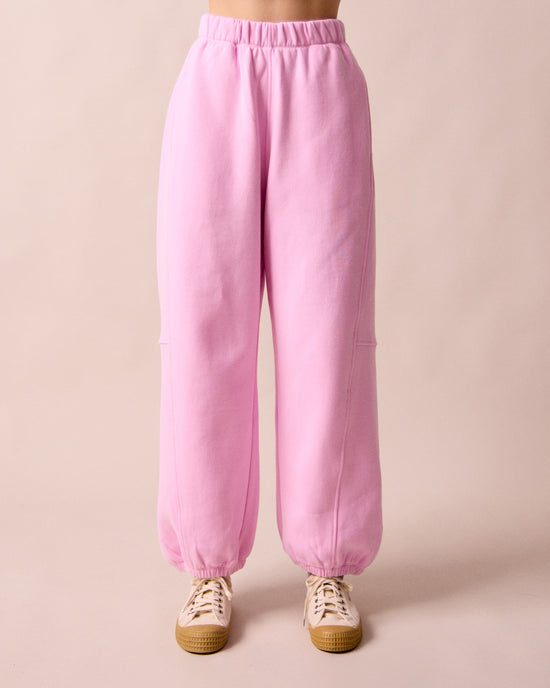 model wears tegan orchid pink fleeceback  jersey trousers front
