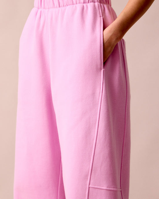 model wears tegan orchid pink fleeceback  jersey trousers