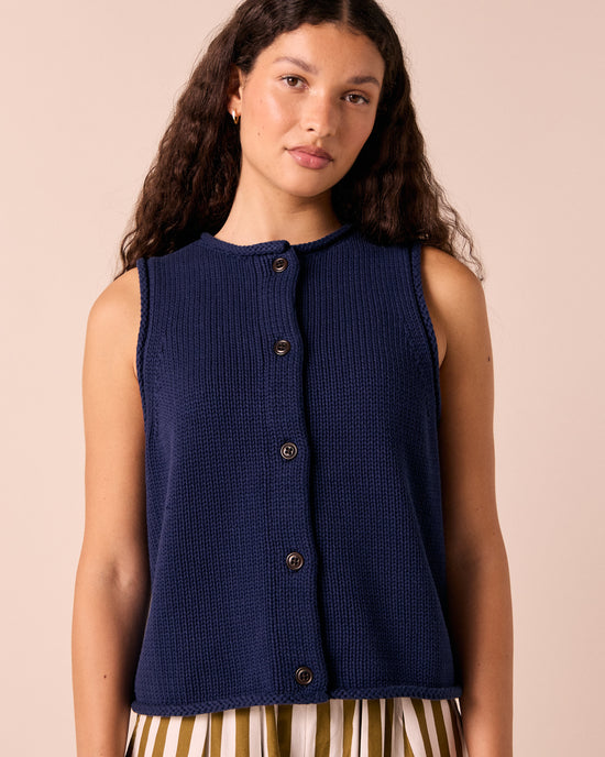 model wears tia navy knitted vest