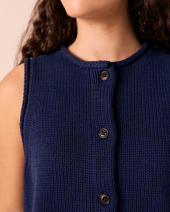 model wears tia navy knitted vest