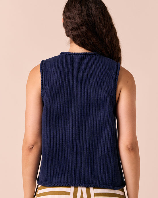 model wears tia navy knitted vest