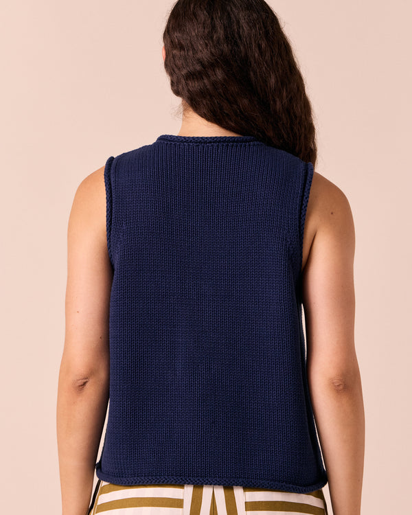 model wears tia navy knitted vest