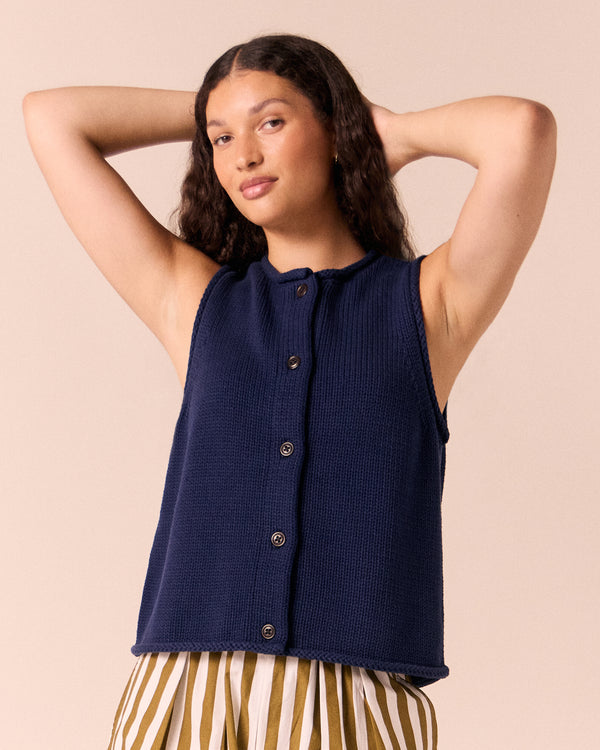 model wears tia navy knitted vest