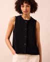 model wears tia black knitted vest